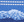 Close-up of blue fabric with white stitching snow mounatin pattern, a color swatch picture