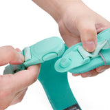 Hands operating quick-release magnetic buckle on Soul and Tail Mint Green dog harness