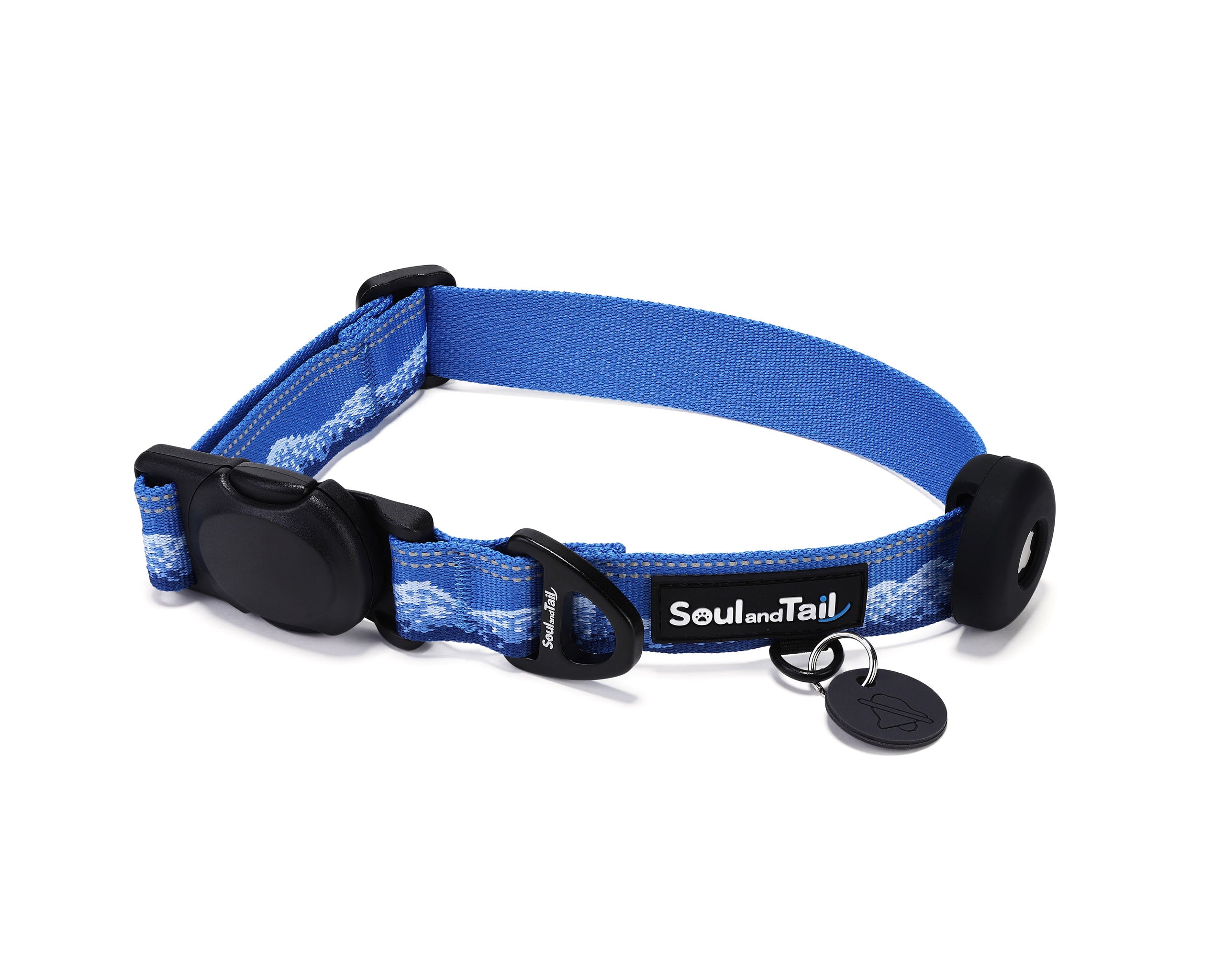 Blue dog collar with frosted peaks pattern on its webbing, integrated with a black tag silencer, aluminum ring, silicon airtag holder, assembled by an blackmagnetic buckle on a white background