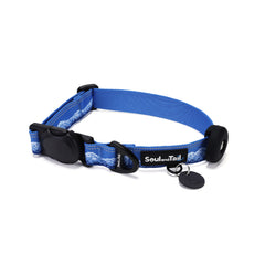 Blue dog collar with frosted peaks pattern on its webbing, integrated with a black tag silencer, aluminum ring, silicon airtag holder, assembled by an blackmagnetic buckle on a white background