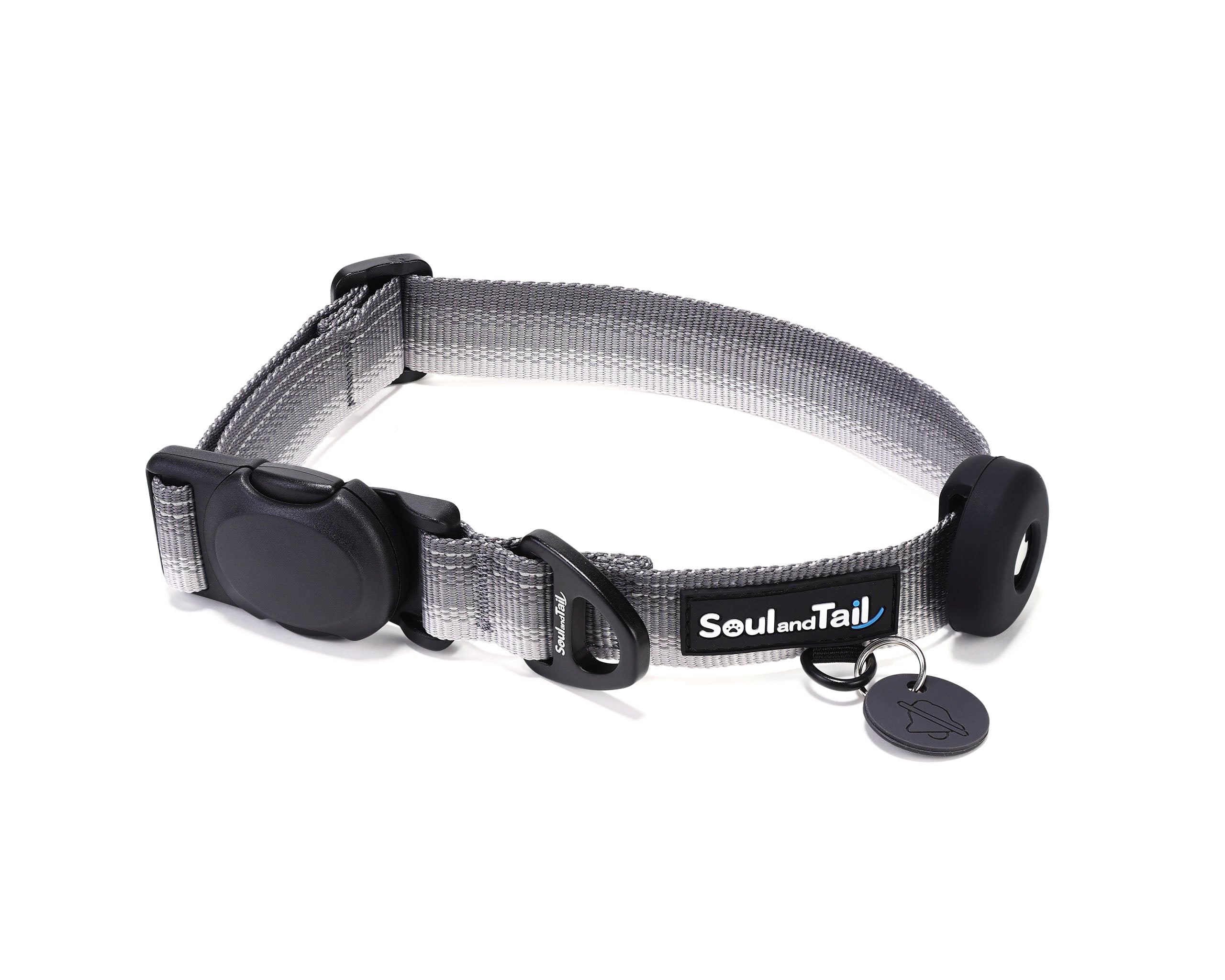 Gray dog collar with a black tag silencer, aluminum ring, silicon airtag holder, assembled by a black magnetic buckle on a white background