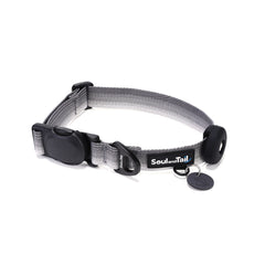 Gray dog collar with a black tag silencer, aluminum ring, silicon airtag holder, assembled by a black magnetic buckle on a white background