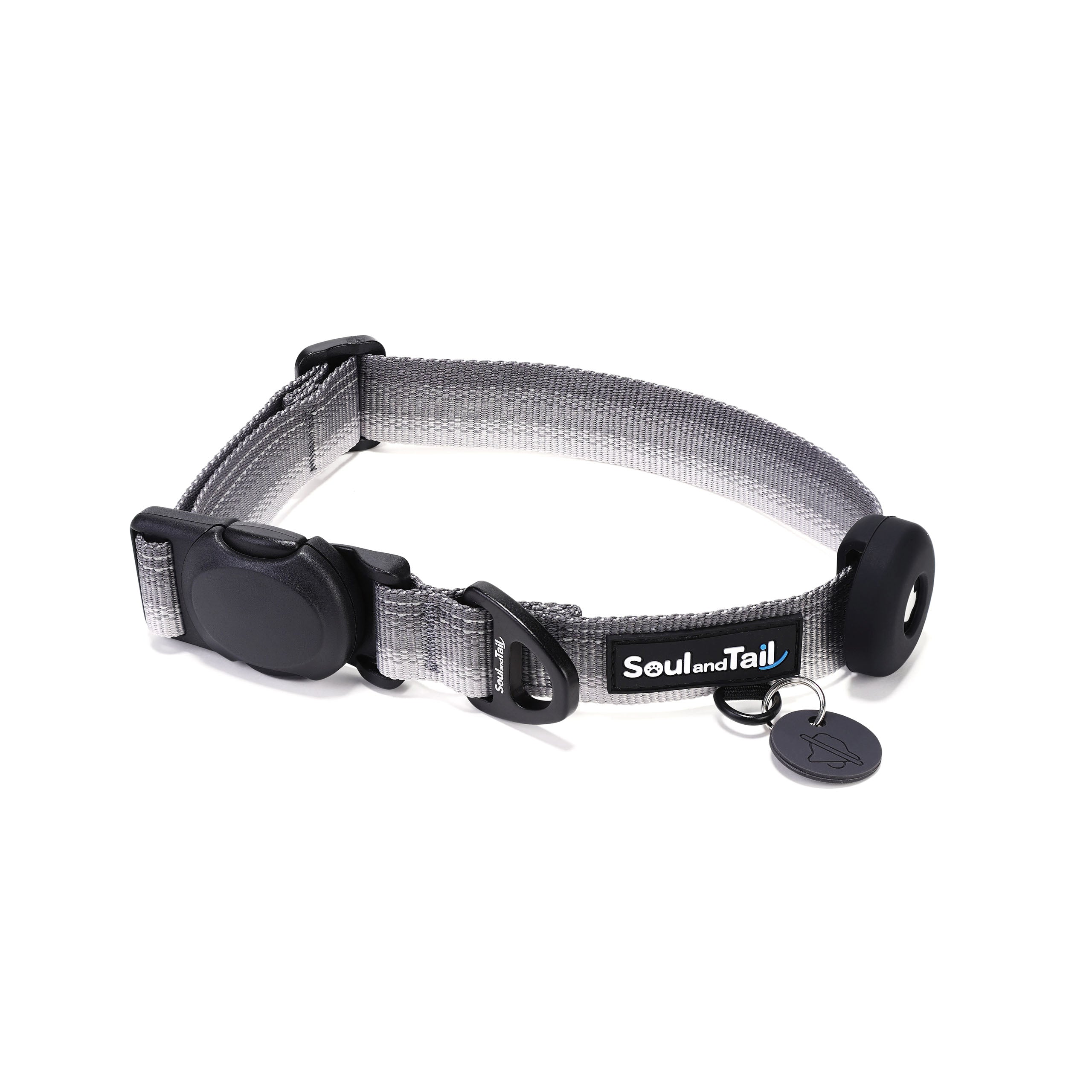 Gray dog collar with a black tag silencer, aluminum ring, silicon airtag holder, assembled by a black magnetic buckle on a white background