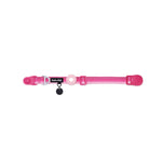 Pink dog collar with a black tag silencer, aluminum ring, silicon airtag holder, with the pink magnetic buckle fully opened and lying on a white background
