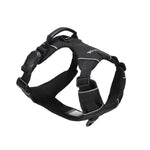 Black dog harness with one side of a black magnetic buckle, an orange vegan leather handle, and two aluminum rings, one on the back, and the other on the front, on a white background  