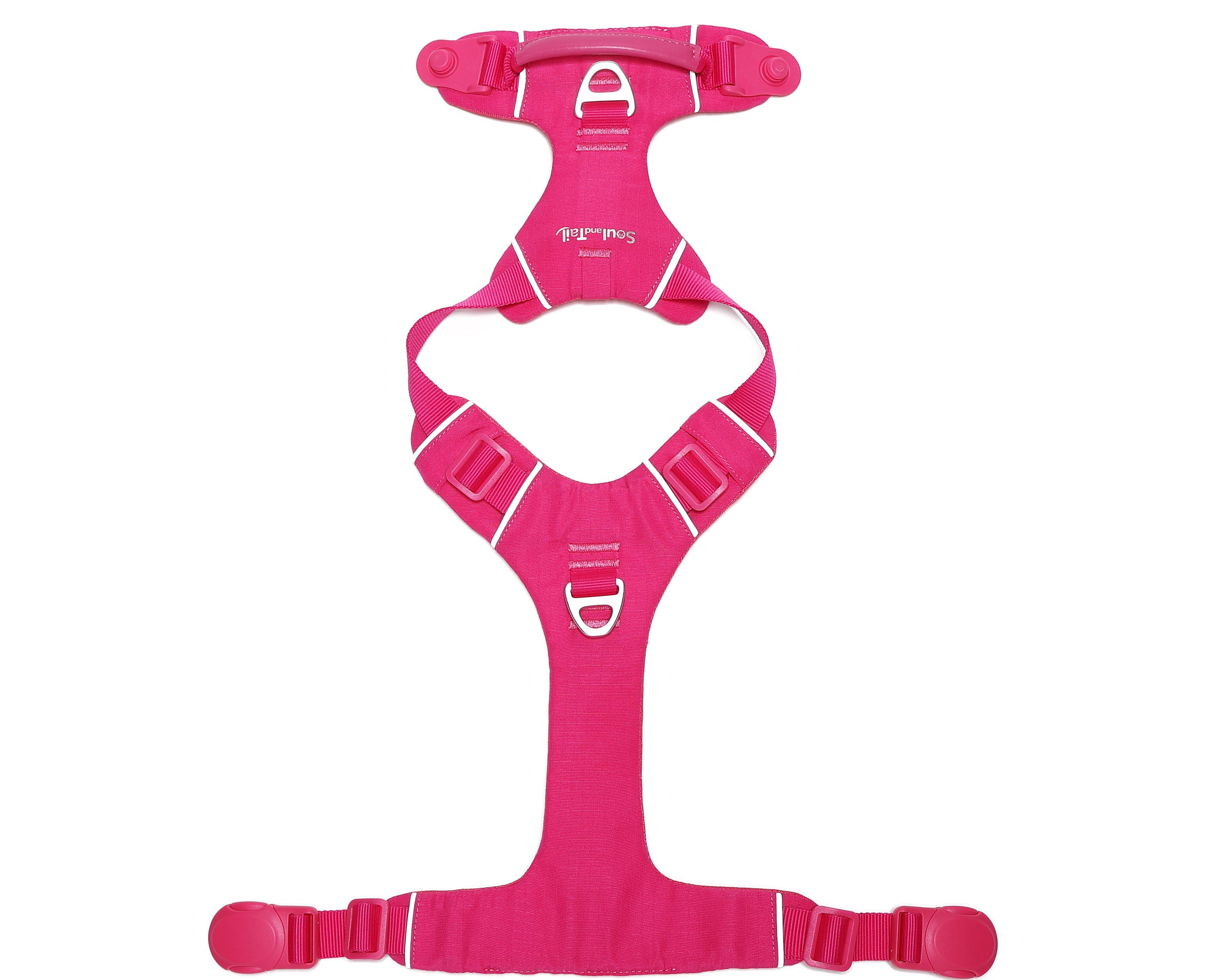 Pink dog harness lying flat on a white background
