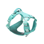 Mint green dog harness with one side of a mint green magnetic buckle, a mint green vegan leather handle, and two aluminum rings, one on the back, and the other on the front, on a white background