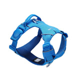 Blue dog harness with one side of a blue magnetic buckle, a blue vegan leather handle, and two aluminum rings, one on the back, and the other on the front, on a white background
