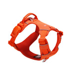 Orange dog harness with one side of an orange magnetic buckle, an orange vegan leather handle, and two aluminum rings, one on the back, and the other on the front, on a white background 