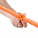 Hand holding an orange strap with a sliding buckle base on a white background