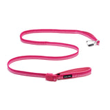 Pink dog leash with an aluminum carabiner & a pink magnetic buckle, lying on a white background